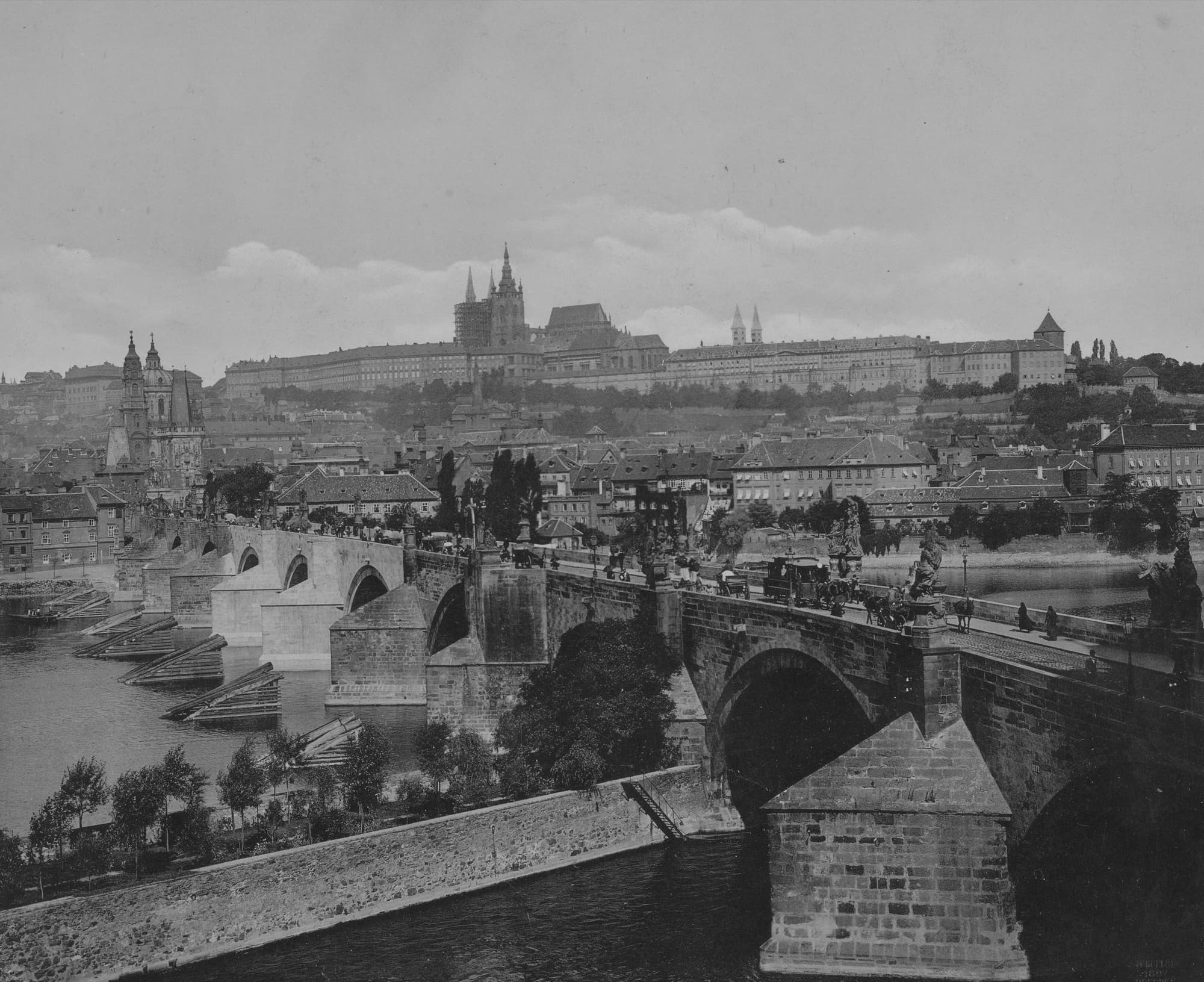 Charles Bridge crossing the Vltava in 1897, with Prague Castle on the hill behind it